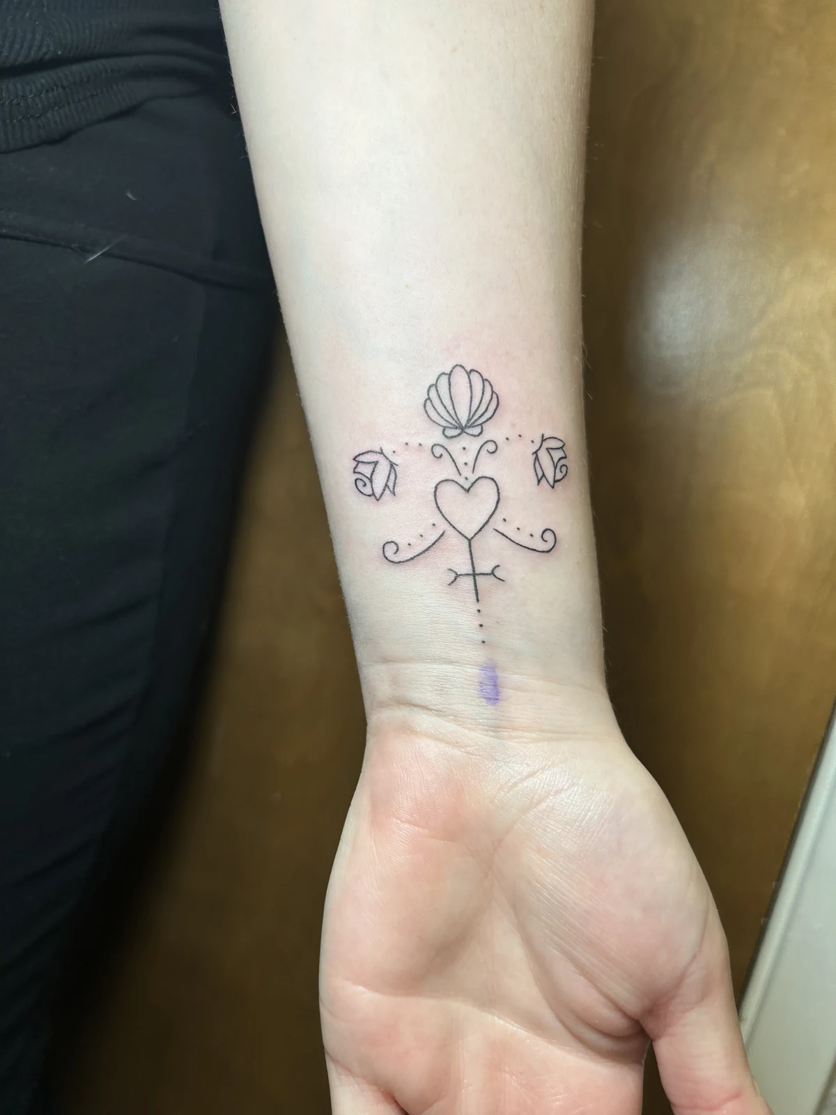 Fresh wrist symbols tattoo